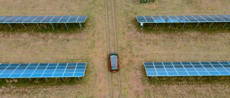 Electric car between solar panels